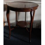 A mahogany occasional table, with circular top on slender cabriole legs joined by an undertier,