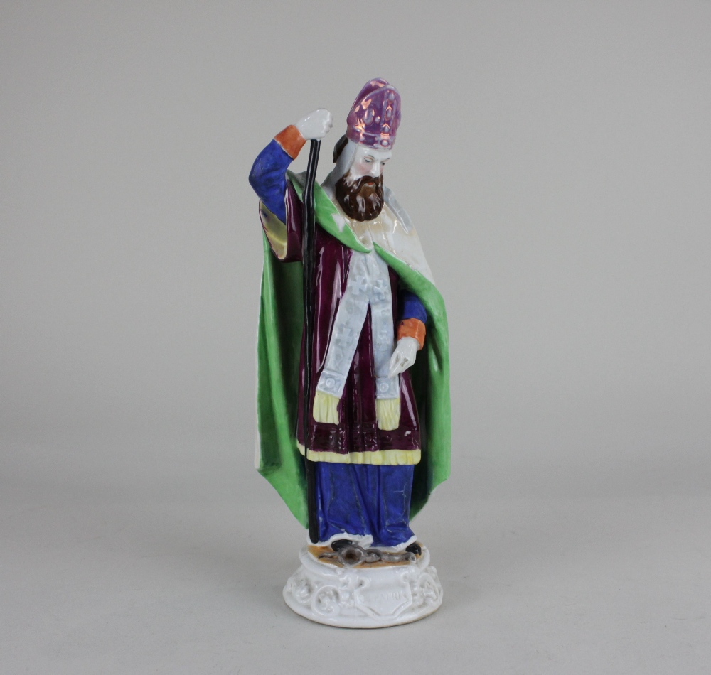 A Staffordshire pottery figure of Saint Patrick 24.5cm high