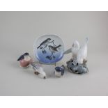 Four Royal Copenhagen porcelain models of birds to include a figure group of two doves 13.5cm,