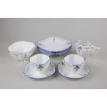 A Shelley porcelain 'Blue Iris' pattern part tea service, Queen Anne shape, comprising sugar bowl,