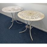 A pair of white painted metal circular garden tables pierced tops on three curved legs, 69cm