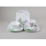 A Shelley porcelain 'Crocus' pattern part tea set comprising tea cup and saucer, sugar bowl, and