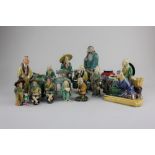 A collection of Chinese glazed pottery figures and model building, tallest 30cm, together with a