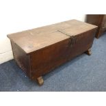 An antique oak coffer metal strap hinges and lock plate, on later trestle feet, width 140cm, depth