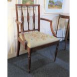 A Sheraton style inlaid mahogany elbow chair with drop in seat on fluted tapering legs