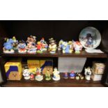 A collection of Coalport and Royal Doulton Paddington Bear figures, some boxed, together with some