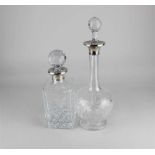 A George V silver mounted cut glass decanter baluster shape with silver collar and later stopper,