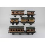 A collection of ten Bing tinplate LSWR model railway coaches, eight boxed, together an assortment of