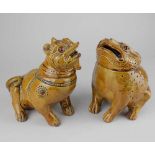 A pair of honey glazed pottery models of a toad and a Fo dog each formed as a pot with detachable