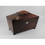 A George III mahogany sarcophagus tea caddy interior with two lidded compartments and central well