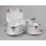 A Shelley porcelain 'Red Daisy' tea cup and saucer, cake plate, coffee cup and saucer and milk jug
