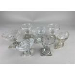 A collection of seven cut glass salt cruets to include a baluster shaped pair and oval pedestal