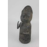 An African bronze figure wearing a lattice effect hat and vest 26cm high