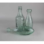 Two F Chitty Chichester green glass bottles, and another for Ellman's Royal Embrocation For Horses