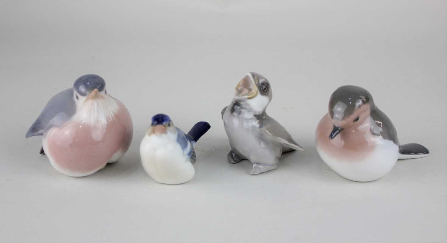 Four Royal Copenhagen porcelain model birds to include two robins