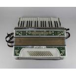 A Hohner 'Verdi I' piano accordion with leather straps, cased, together with a booklet 'Feldman's