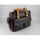 A Louis Vuitton leather monogram handbag with dust protector