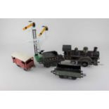 A collection of Hornby O gauge tinplate clockwork model railway to include various rolling stock,