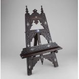 An Eastern carved wood and mother of pearl inlaid table easel 45cm high (a/f)