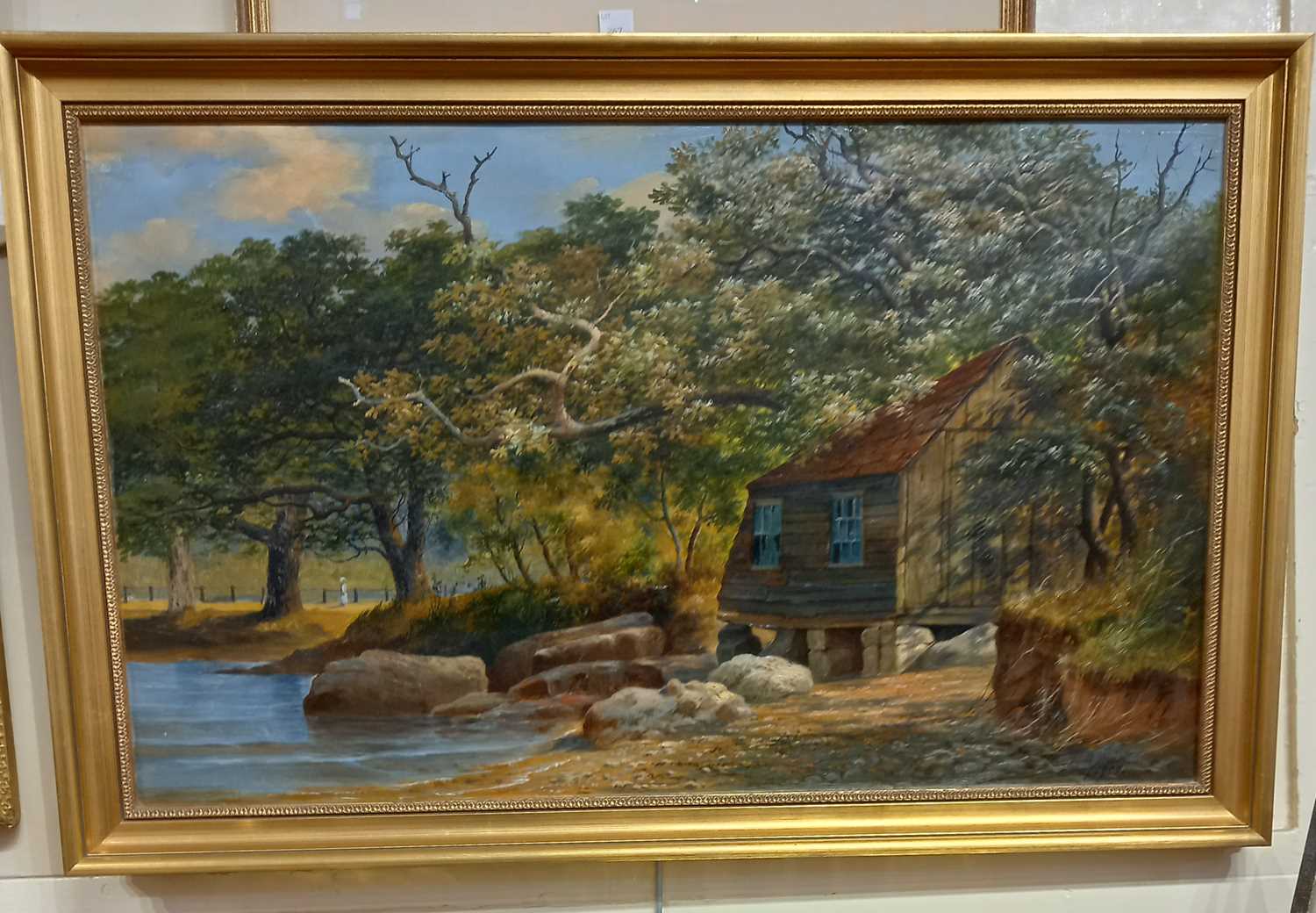 W R Buist (Early 20th Century) view of a boat house in woodland, oil on canvas, reverse inscribed '