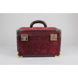 A Must de Cartier vanity case in burgundy suede width 32.5cm, height 20.5cm, depth 23cm
