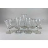 A set of four trumpet shape wine glasses a pair of baluster wine glasses and three fluted glasses