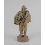 A pottery figure of a woodcutter 19cm high