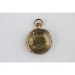 A gold cased key wind open face lady's fob watch with an unsigned gilt jewelled cylinder movement