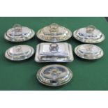 Seven plated tureens and covers comprising a set of three oval tureens, a pair and two others