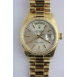 A Rolex Oyster Perpetual Day-Date 18ct gold gentleman's bracelet wristwatch, the signed silvered