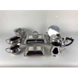 A collection of silver plated tableware to include a three piece tea set with half fluted