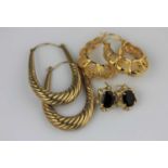 A pair of gold hoop shaped filigree earrings, having indistinct marks to the wires, 5.6g, a pair
