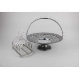 A silver plated circular cake basket with swing handle and pedestal base, 26cm together with a