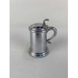 A Dunhill chrome plated table lighter in the form of a lidded tankard 9cm high