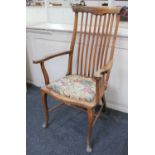 A slatted back open armchair with drop in tapestry seat