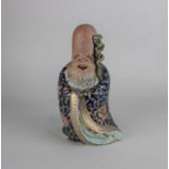 A Japanese ceramic figure of Fukurokuju 26cm high (a/f)