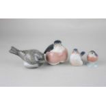 Four Royal Copenhagen porcelain models of birds to include two robins and a sparrow