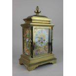 A 19th century French brass and porcelain panel mantle clock with Japy Freres movement, the