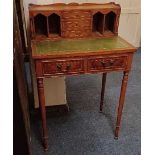 A small reproduction yew wood ladies writing desk, three small drawers flanked by pigeon holes, with