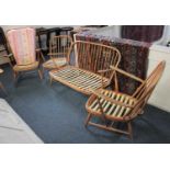 A pale Ercol three piece suite comprising a settee and two armchairs and another similar Ercol chair