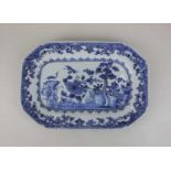 A Chinese blue and white rectangular dish with canted corners, decorated with birds in a garden with