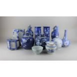 A pair of Chinese porcelain blue and white prunus ginger jars and covers (one cover repaired) and