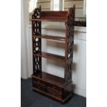A Georgian style mahogany open bookcase with fretwork sides and four small drawers to base 51cm