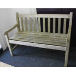 A wooden garden bench with slatted back and seat, 122cm