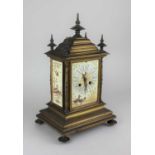 A 19th century French gilded brass striking mantle clock with ceramic panels decorated with birds,