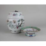 A Chinese porcelain pot and cover decorated with figures in a landscape 16cm high, together with a