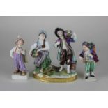 A Dresden porcelain figure group of a flower selling couple 14cm and two single Sitzendorf figures
