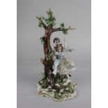 A Capodimonte porcelain figure group of a gentleman and lady on a swing 29cm high (a/f)