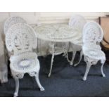 A white painted metal circular garden table and four garden chairs