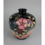 A Moorcroft pottery Oberon pattern baluster vase 20cm high